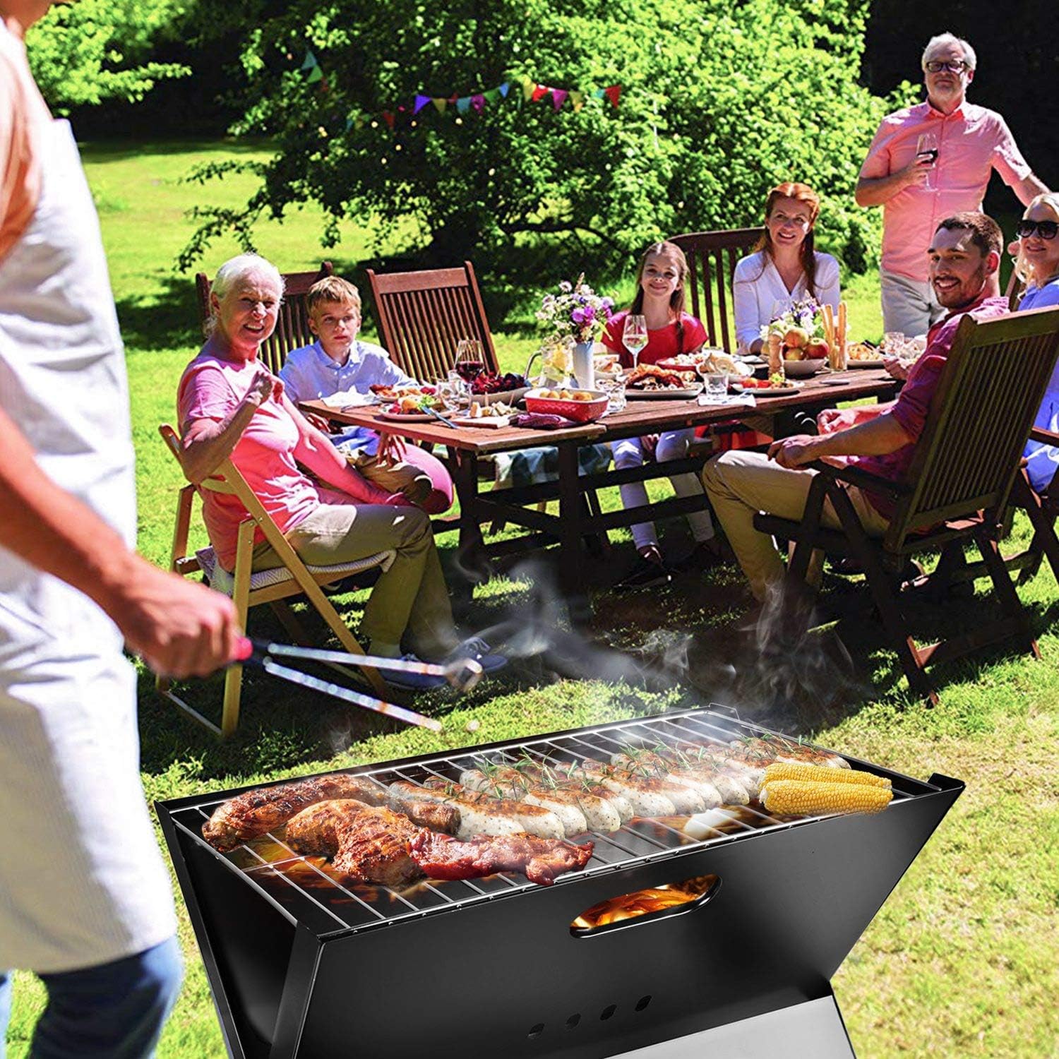 Portable charcoal barbecue grill used for outdoor family gathering and backyard picnic cooking